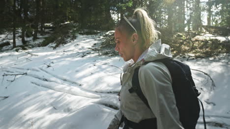 backpacker woman on a winter hiking in tatra mountains near zakopane, poland. slow motion shot