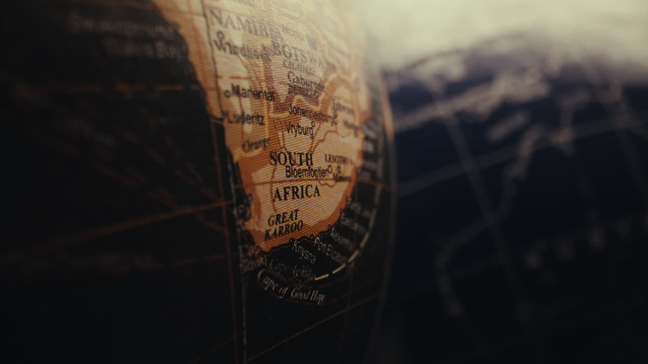 Close-up of a vintage world globe, focusing on South Africa