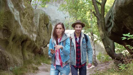 young couple with backpack traveling