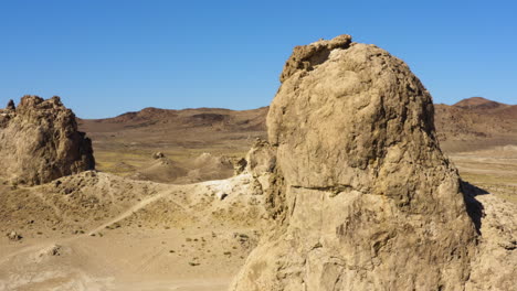 trona pinnacles in california desert area, aerial drone orbit view