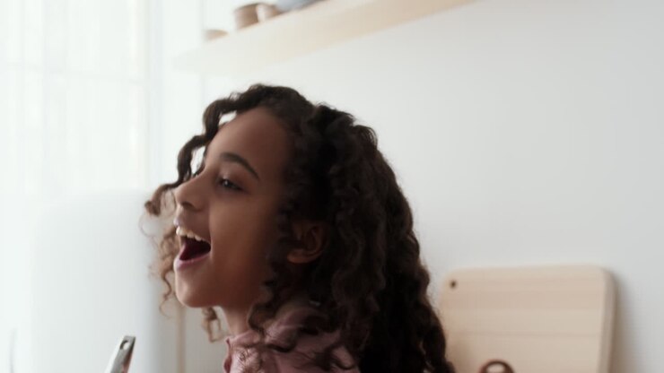 Young Girl Cooking and Having Fun in the Kitchen