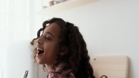 young girl cooking and having fun in the kitchen