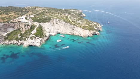 stunning blue caves carved into limestone cliffs in zakynthos island, greece