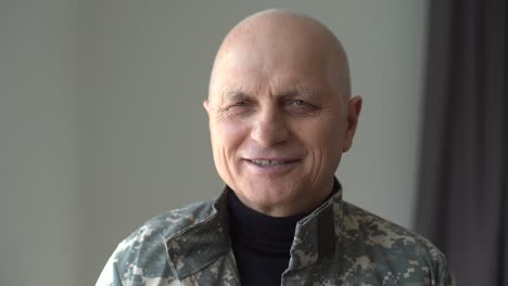 Headshot-of-aged-Caucasian-military-man-indoors.-Close-up-portrait-of-frustrated-depressed-veteran-in-uniform.-Mental-health-problems-and-crisis-concept