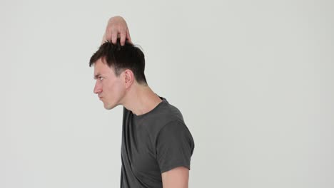 man scratching head in confusion or thought