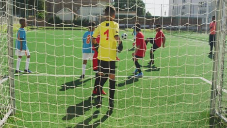 soccer kids playing in a sunny day