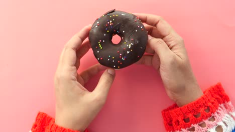 chocolate donut in hands