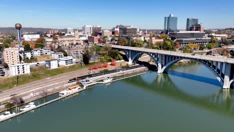 tennessee river aerial push in to knoxville tennessee skyline