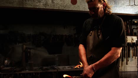 blacksmith working on a horseshoe