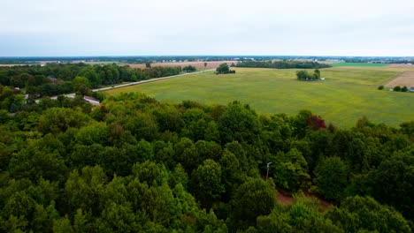 majestic aerial video shoot of vast agriculture fields and forest, location west michigan, usa