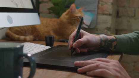 unrecognizable graphic designer drawing on tablet