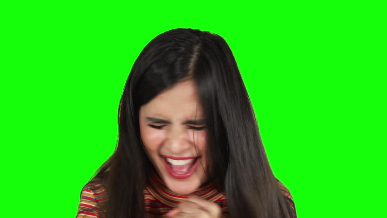 Angry young woman screaming in the studio
