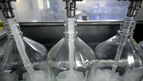 high-speed automated bottling process of large water containers