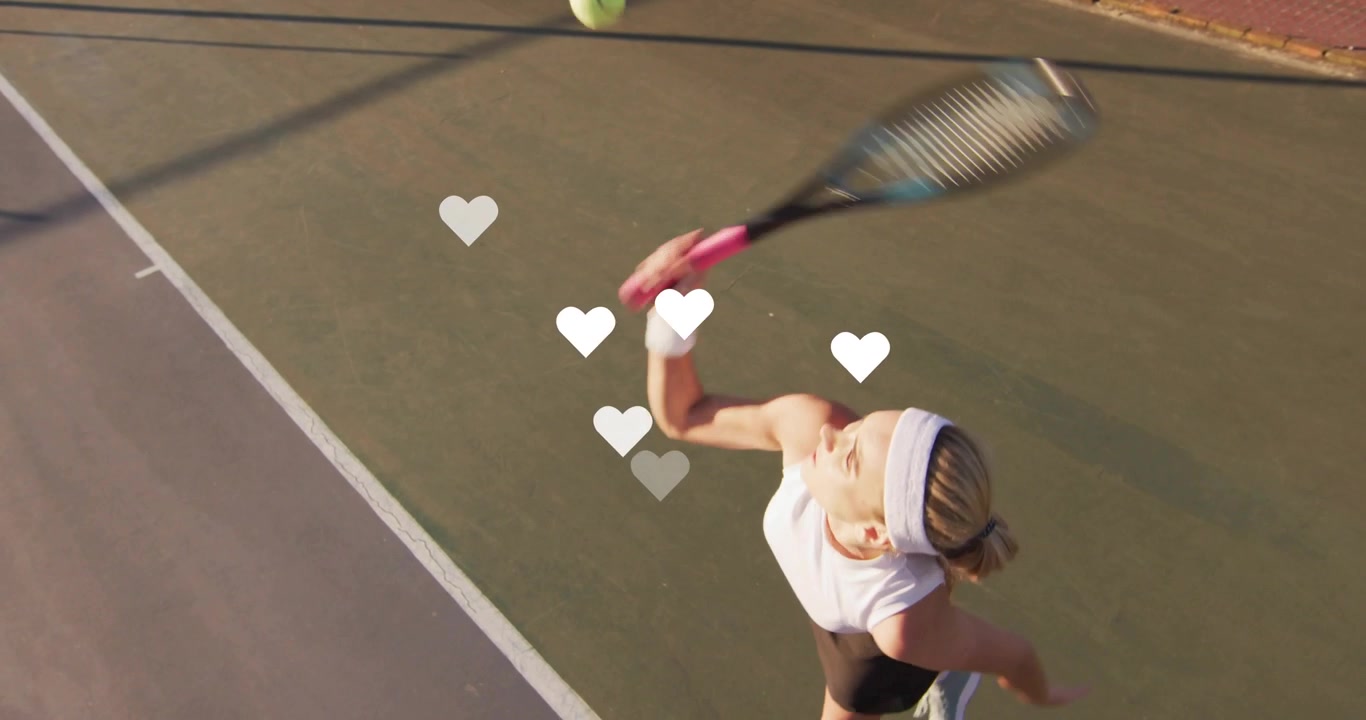 Serving woman tennis player swinging racket tossing ball on hardcourt headband, hearts, copy space
