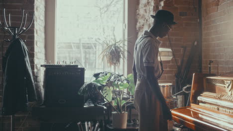 man playing piano in a vintage cafe