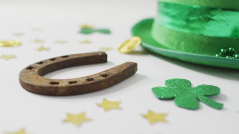 Shamrocks-and-stars-with-green-hat-with-horseshoe-with-copy-space-on-white-background