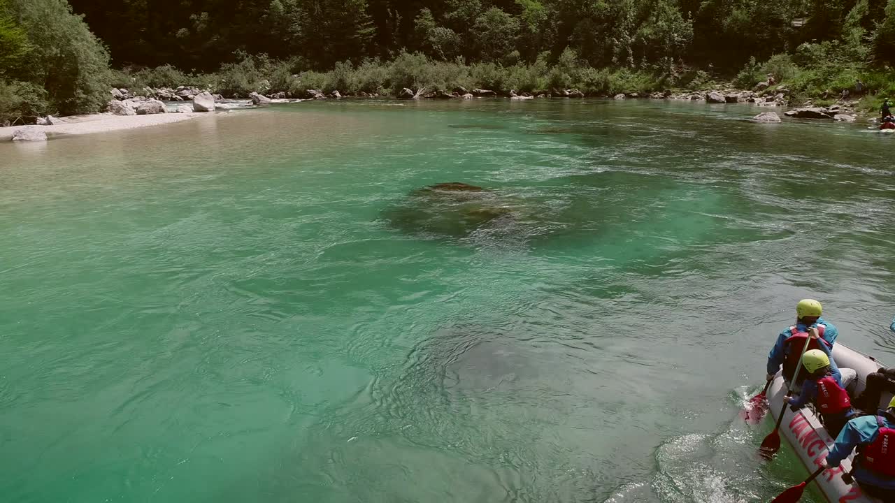 Aerial view of a group paddling in the rafting boat at the Soca River, Slovenia.
