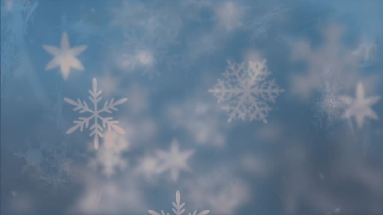 Snowflakes moving against blue background