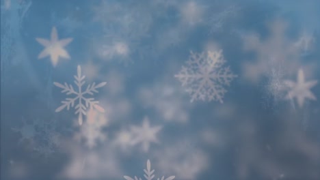 Snowflakes-moving-against-blue-background
