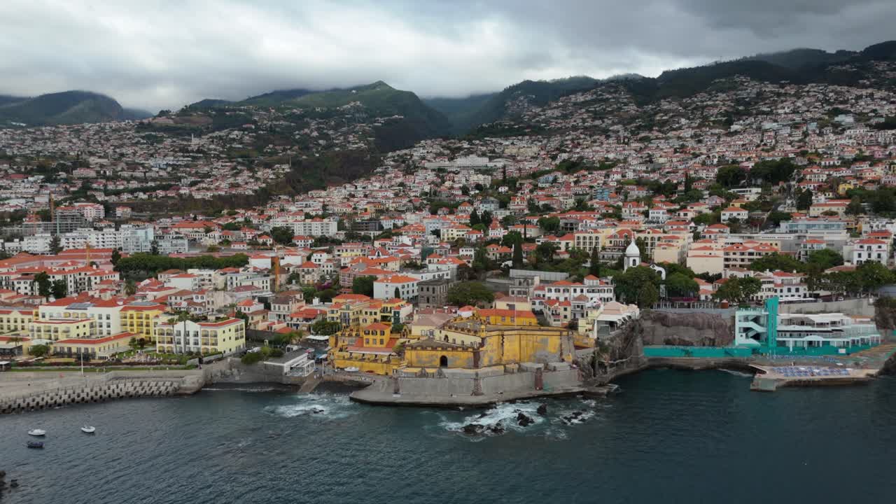Forte de Sao Tiago Historic Landmark, Madeira Coastline, Aerial Reveal