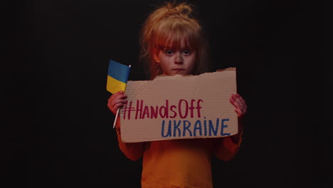 upset poor girl homeless protesting war conflict raises banner with inscription hands off ukraine