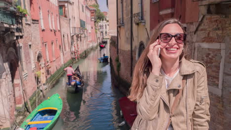 woman enjoying a phone call in venice, italy