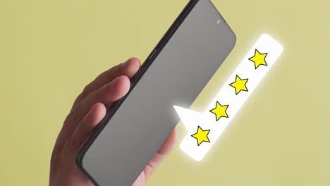 Person-holding-a-mobile-phone-where-the-line-stars-animation-appears,-yellow-background