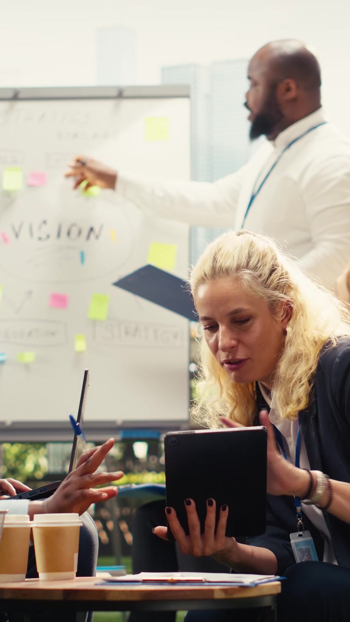 Vertical Video Diverse coworkers exchanging ideas in informal strategy session