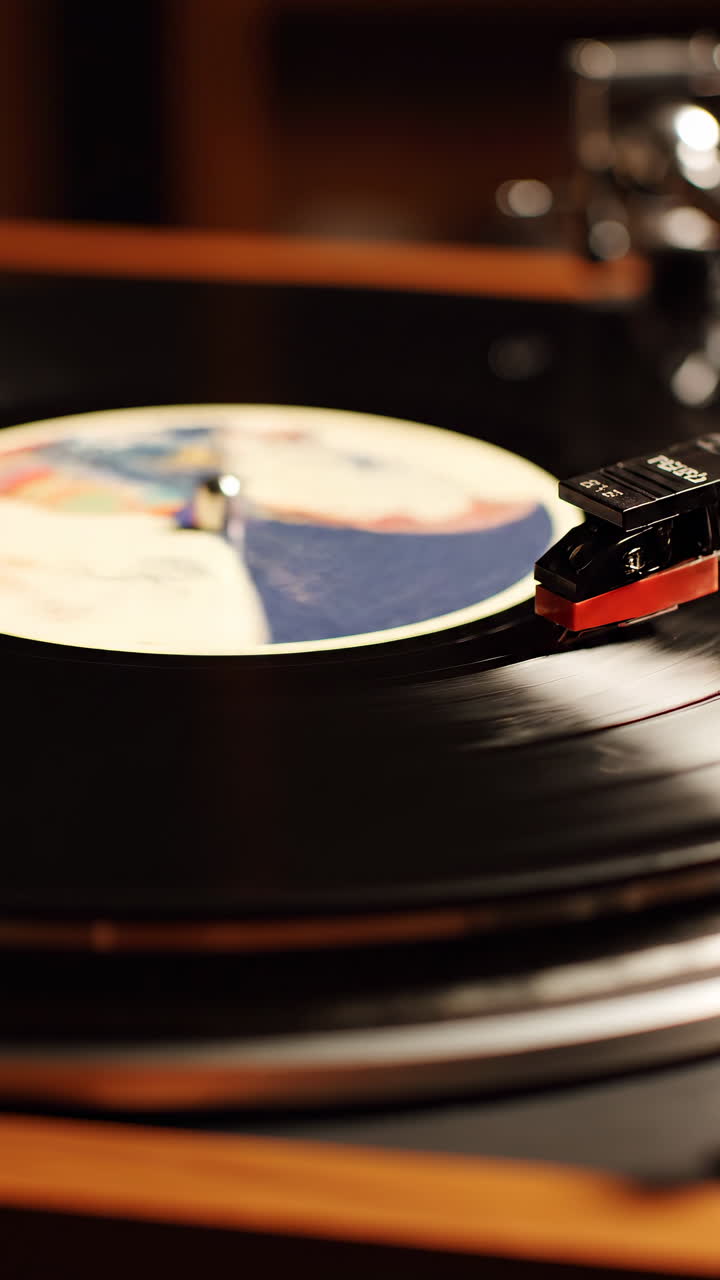 Closeup Vintage Vinyl On Turntable Spinning, Stylus Tracking Grooves In Warm Wooden Console. Softfocus