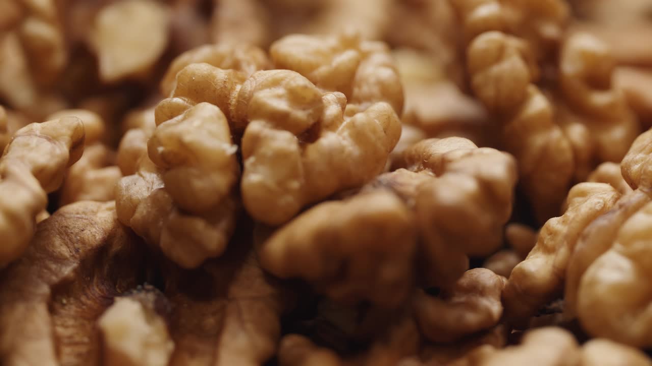 Smooth Camera Movement Over a Handful Walnuts.