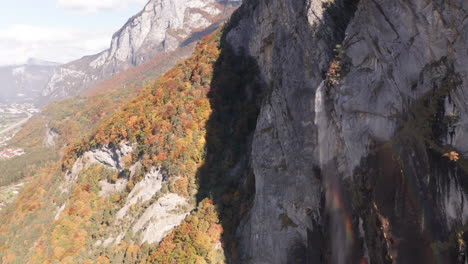 aerial of rainbow being created by waterfall