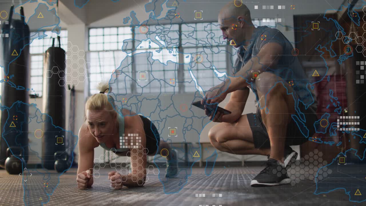 Vertical video: Holding female athlete in sportswear planking at gym, trainer timing on phone HUD