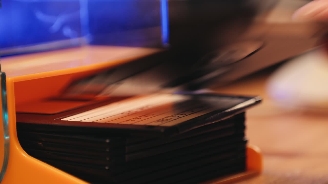 Using diskette for old computer. Music recorder, playing retro computer games. Vintage device for office, obsolete technology. . High quality 4k footage