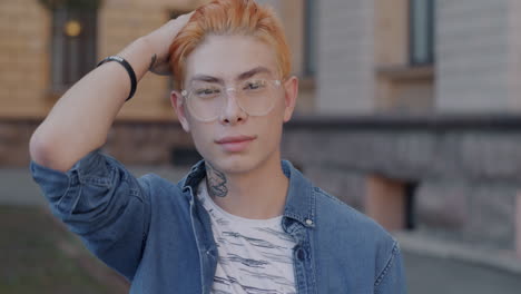 young man with ginger hair and glasses