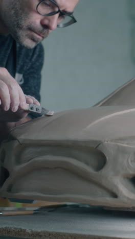 sculpting a clay car model