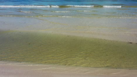 i love u written in the sand as camera pitches up to reveal the ocean