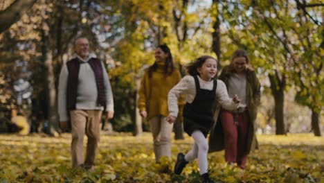 Caucasian-family-walking-in-park-together