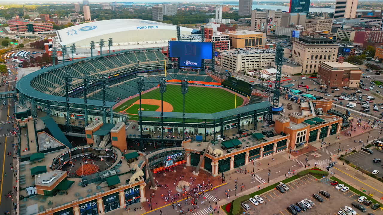 Lots of people walk at the entrance and around Comerica Stadium in Detroit, Michigan, USA. Sport life and events of the big city. Aerial view. Detroit, USA, 28 July 2025: