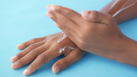 applying lotion to hands