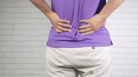 man experiencing back pain