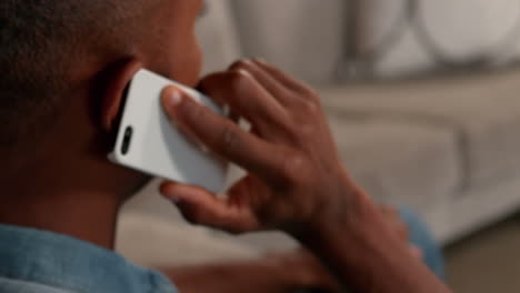 man talking on the phone in living room