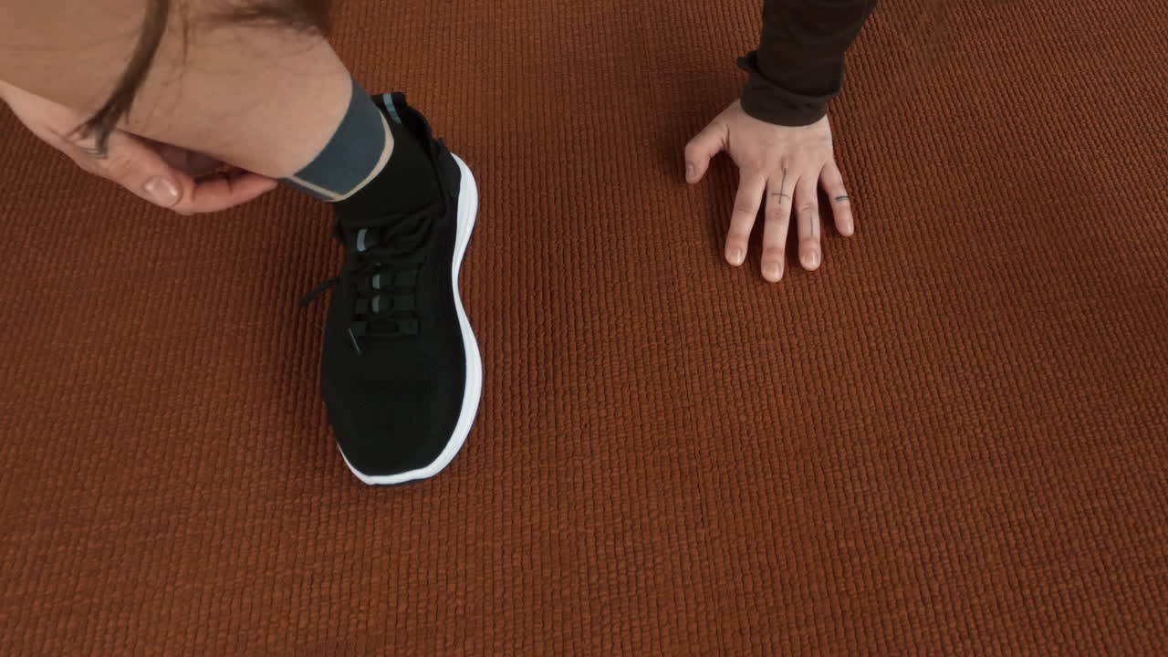 Person exercising and stretching on a mat