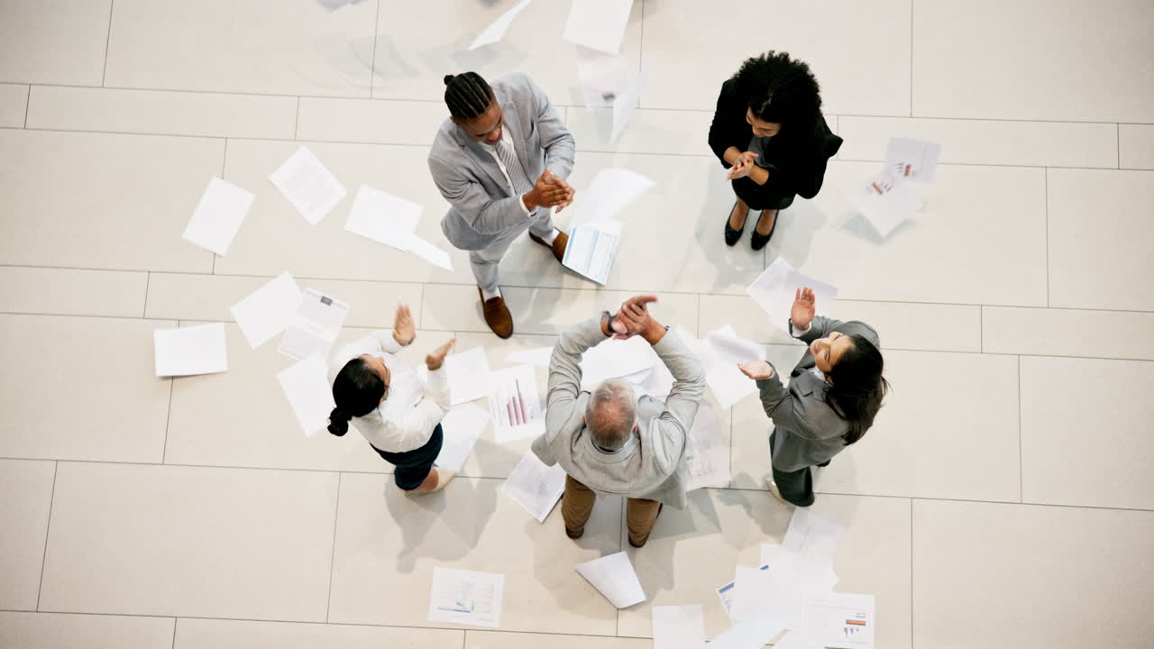 Celebration from above, business people throwing