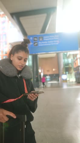 teenage girl at the airport waiting to board