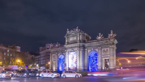 timelapse of puerta de alcalá landmark during night, christmas lights