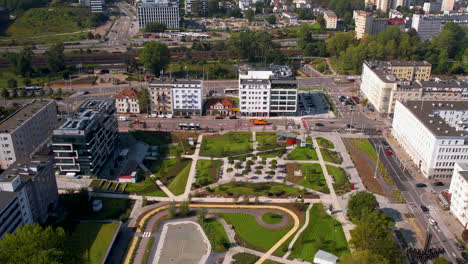 aerial pullback establishing park centralny with urban infrastructure supporting public space