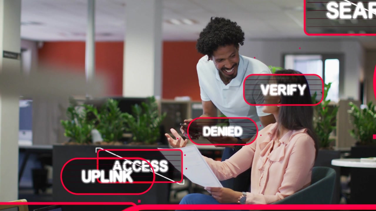 Coworkers reviewing document with tablet, DENIED showing, overlays stacking and verifying uplink