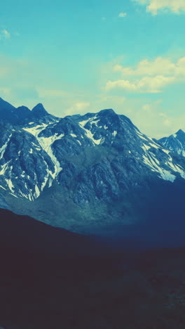 a scenic view of a snow-capped mountain range