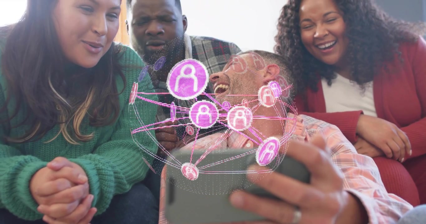 Group of friends exploring rotating pink holographic tech mesh projecting above smartphone in room