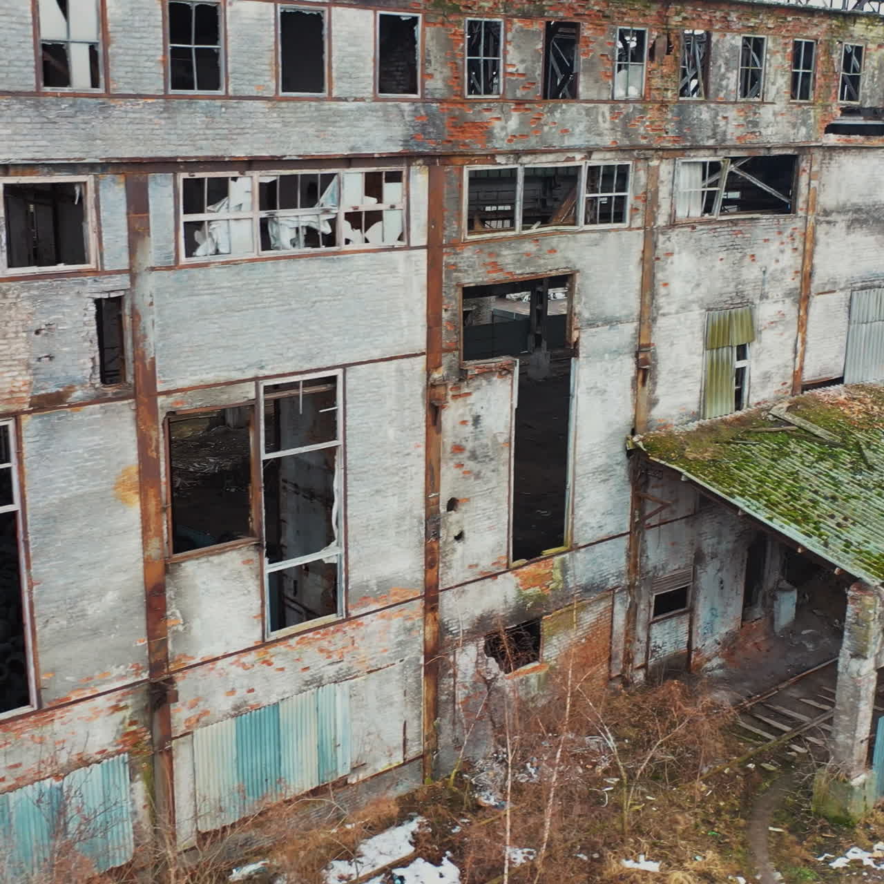 Old used tires in abandoned factory. Aerial view of an abandoned industrial plant